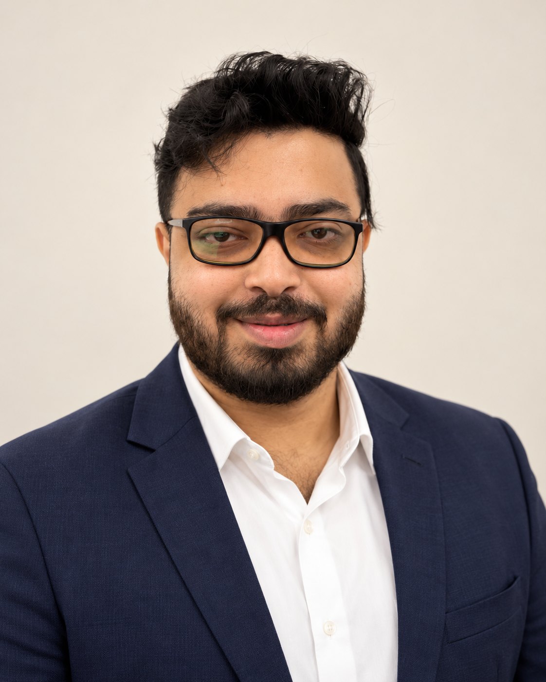 Amitrosudan Basu in a navy blazer and white shirt